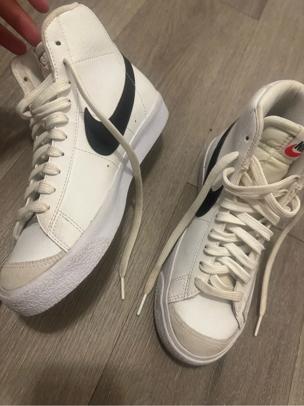 Nike Women's White High-Top Sneakers with Black Swoosh
